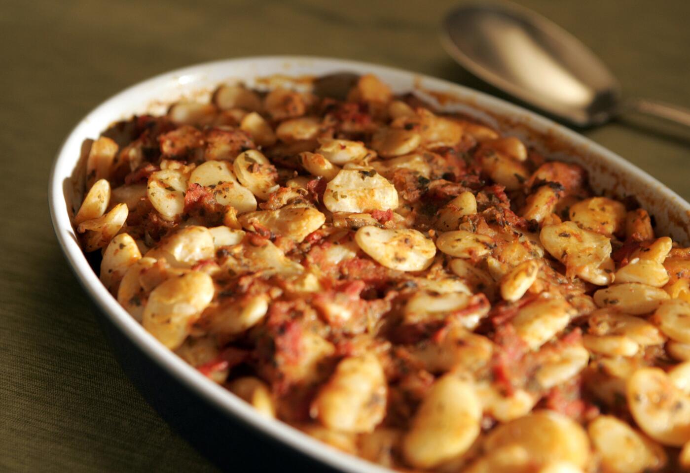 Baked giant white beans with tomatoes. Recipe here.