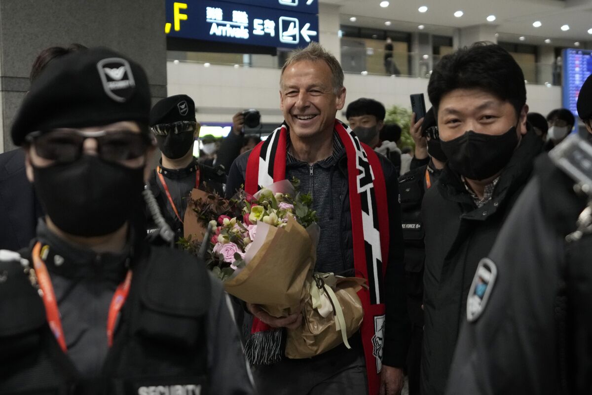 South Korea's new national soccer team head coach Jurgen Klinsmann leaves after a press conference at the Incheon International Airport in Incheron, South Korea, Wednesday, March 8, 2023. Klinsmann, who won the World Cup as a player with West Germany in 1990, replaces Paulo Bento. The Portuguese coach left the team after leading South Korea to the second round at last year's World Cup in Qatar. (AP Photo/Ahn Young-joon)