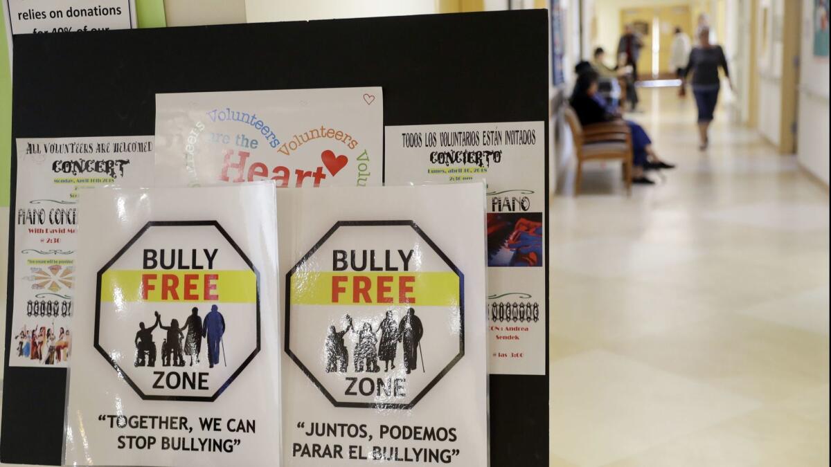 Signs promote a bully-free environment at an establishment in San Francisco.