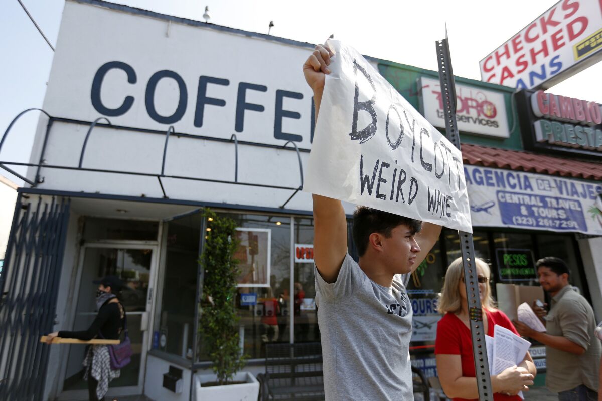 Opponents of Weird Wave Coffee in Boyle Heights demonstrate along East Cesar Chavez Avenue in June.