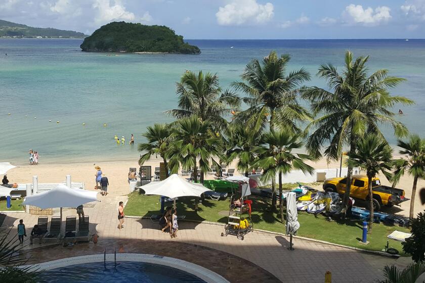 Tourists on a beach in Guam's capital Hagatna. Security and defense officials on Guam said that there is no imminent threat to people there or in the Northern Mariana Islands after North Korea said it was examining its operational plans for attack.