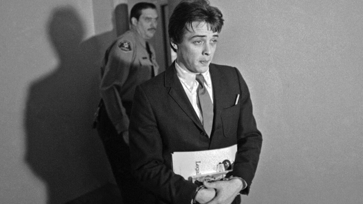 In this Jan. 21, 1970, file photo, Robert Beausoleil, then 21, leaves a courtroom in Los Angeles.