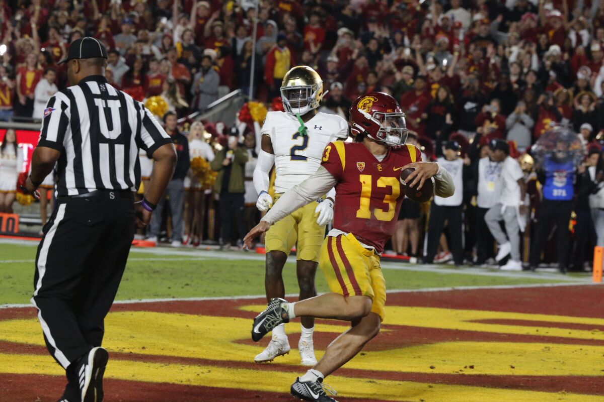 USC quarterback Caleb Williams runs the ball into the end zone for a second-quarter touchdown Nov. 26, 2022.