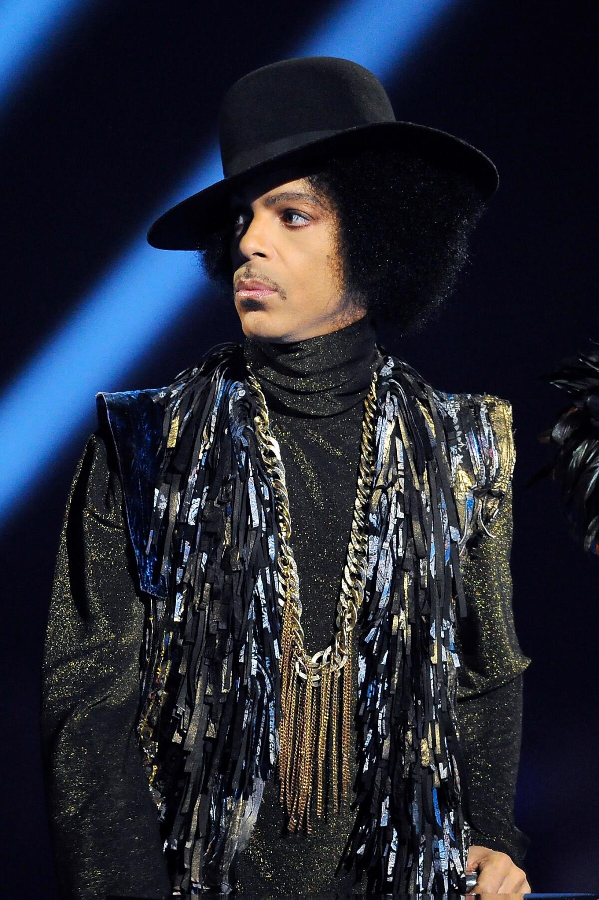 Prince presents the award for British female solo artist at the BRIT Awards 2014 at 02 Arena on Feb. 19, 2014 in London.