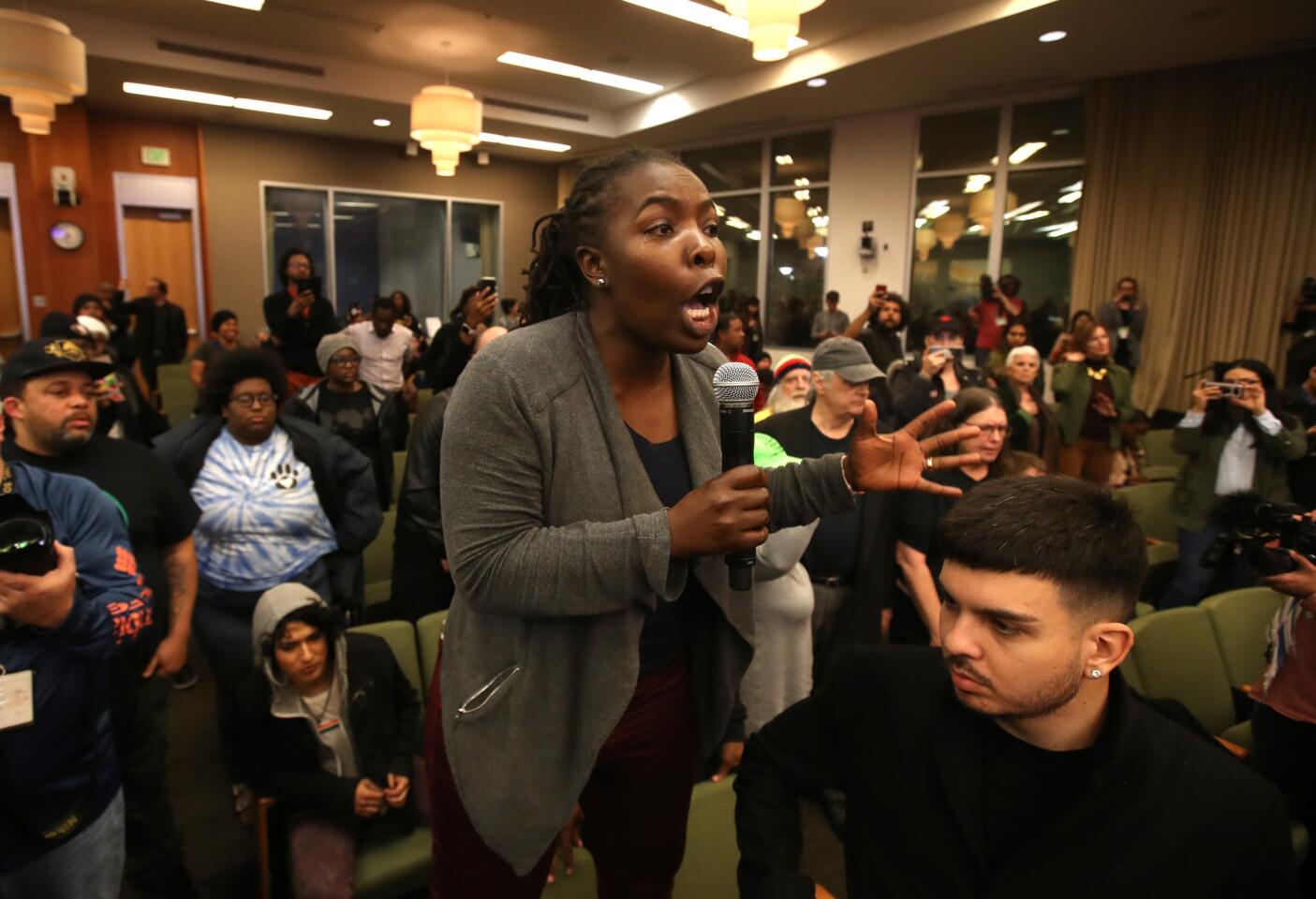Activists disrupt the City Council meeting in Sacramento on Tuesday, a day after more than 80 people were arrested during a march through East Sacramento to protest the district attorney's decision not to bring criminal charges against the officers who fatally shot Stephon Clark.