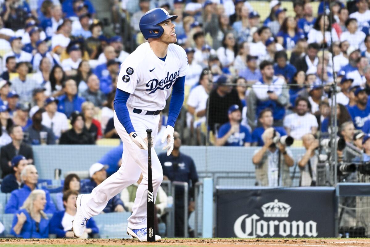 Dodgers first baseman Freddie Freeman watches his solo home run during the first inning against the Padres on Wednesday.