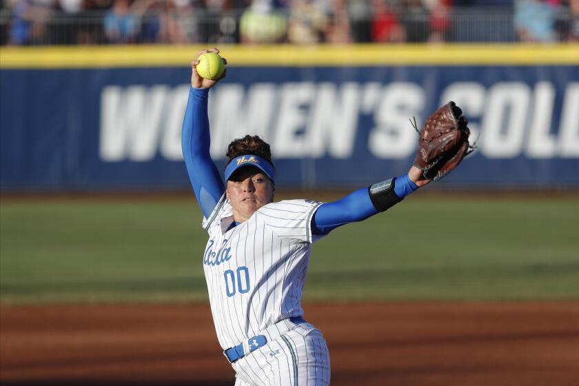 UCLA's Rachel Garcia pitches against Oklahoma during the first inning of Game 2 of the best-of-three championship series in the NCAA softball Women's College World Series in Oklahoma City, Tuesday, June 4, 2019. (AP Photo/Alonzo Adams)