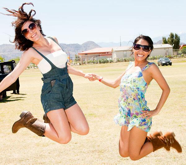 Cayla Rodia, 22, left, from Orange County says her style is "funky and hippie." She is wearing overalls from Forever 21, a tube top from Wet Seal and her Dad's cowboy boots. Davina Ramirez, 21, right, wears a dress from Forever 21. She says her style is "cute and flirty."