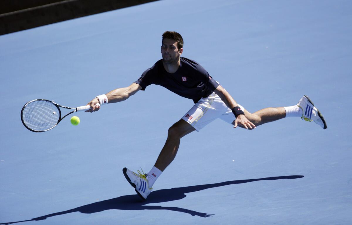 Novak Djokovic of Serbia stretches out for a return during a practice session ahead of the Australian Open at Melbourne Park on Jan. 16.