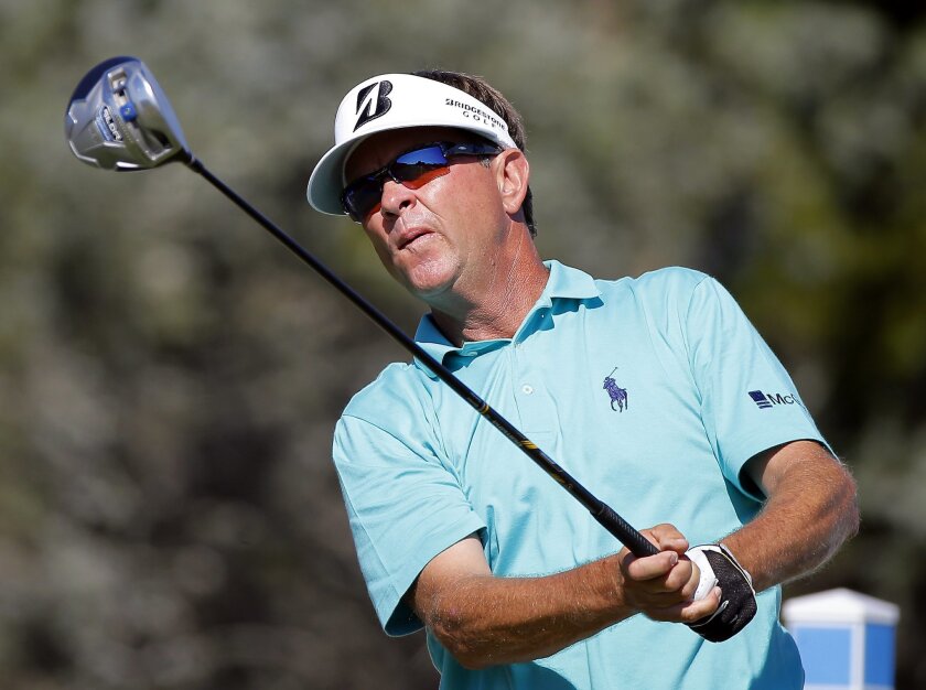 Davis Love III watches his tee shot on the 18th hole during the third round of the McGladrey Classic golf tournament on Saturday, Oct. 25, 2014, in St. Simons Island, Ga.