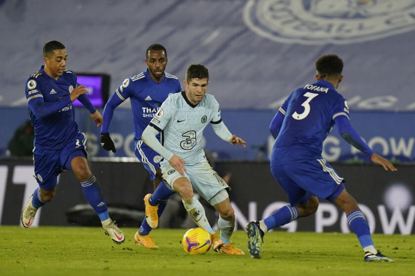 Chelsea's Christian Pulisic, center, tries to dribble past Leicester's Youri Tielemans, left, and Wesley Fofana, right, during the English Premier League soccer match between Leicester City and Chelsea at the King Power Stadium in Leicester, England, Tuesday, Jan. 19, 2021. Leicester City won the match 2-0. (Tim Keeton/Pool via AP)