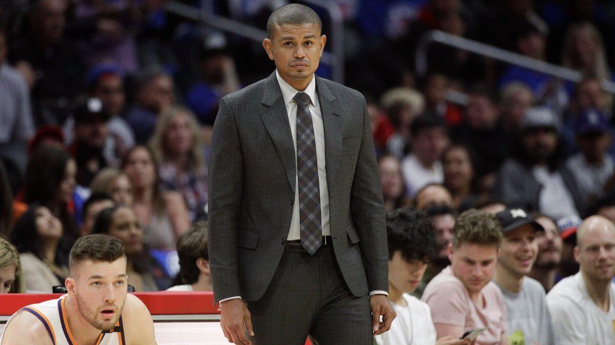 Earl Watson watches action during the second half between the Clippers and Phoenix Suns at Staples Center on Saturday. The Suns fired Watson just three games in to the NBA season.