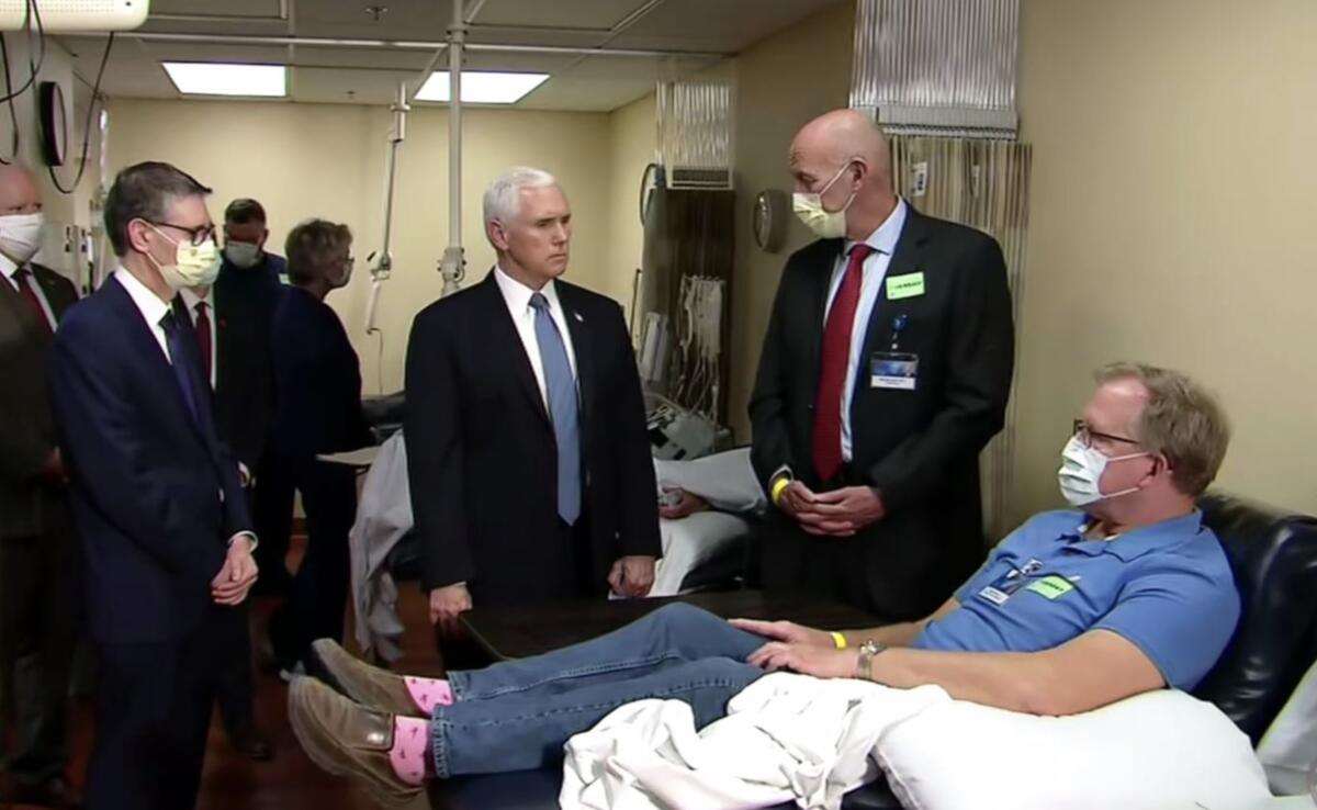 Vice President Pence meets with staff and a patient at the Mayo Clinic. You might notice he's the only one not wearing a mask.