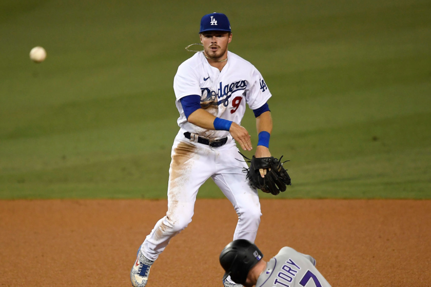 LOS ANGELES, CA - SEPTEMBER 04: Gavin Lux #9 of the Los Angeles Dodgers throws to first base to turn a double play.