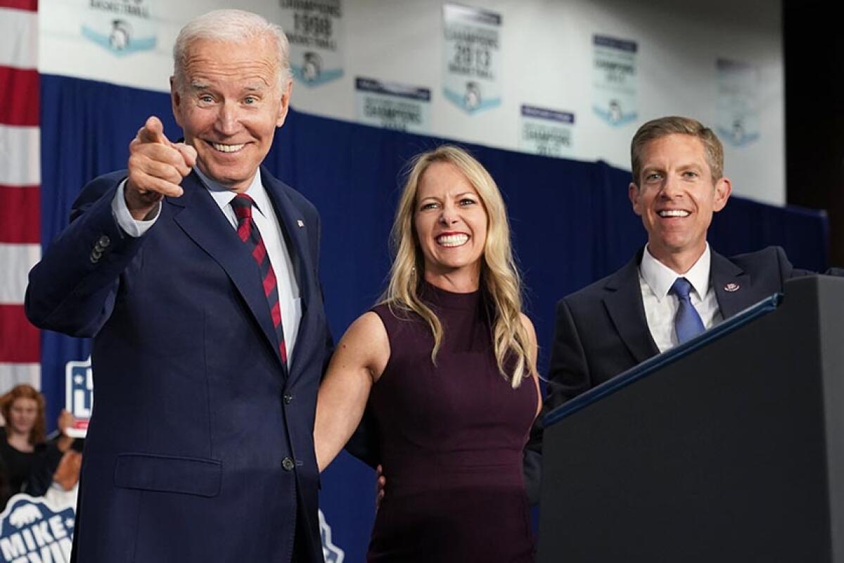 President Biden with Rep. Mike Levin and his wife, Chrissy, during a campaign event in Oceanside.