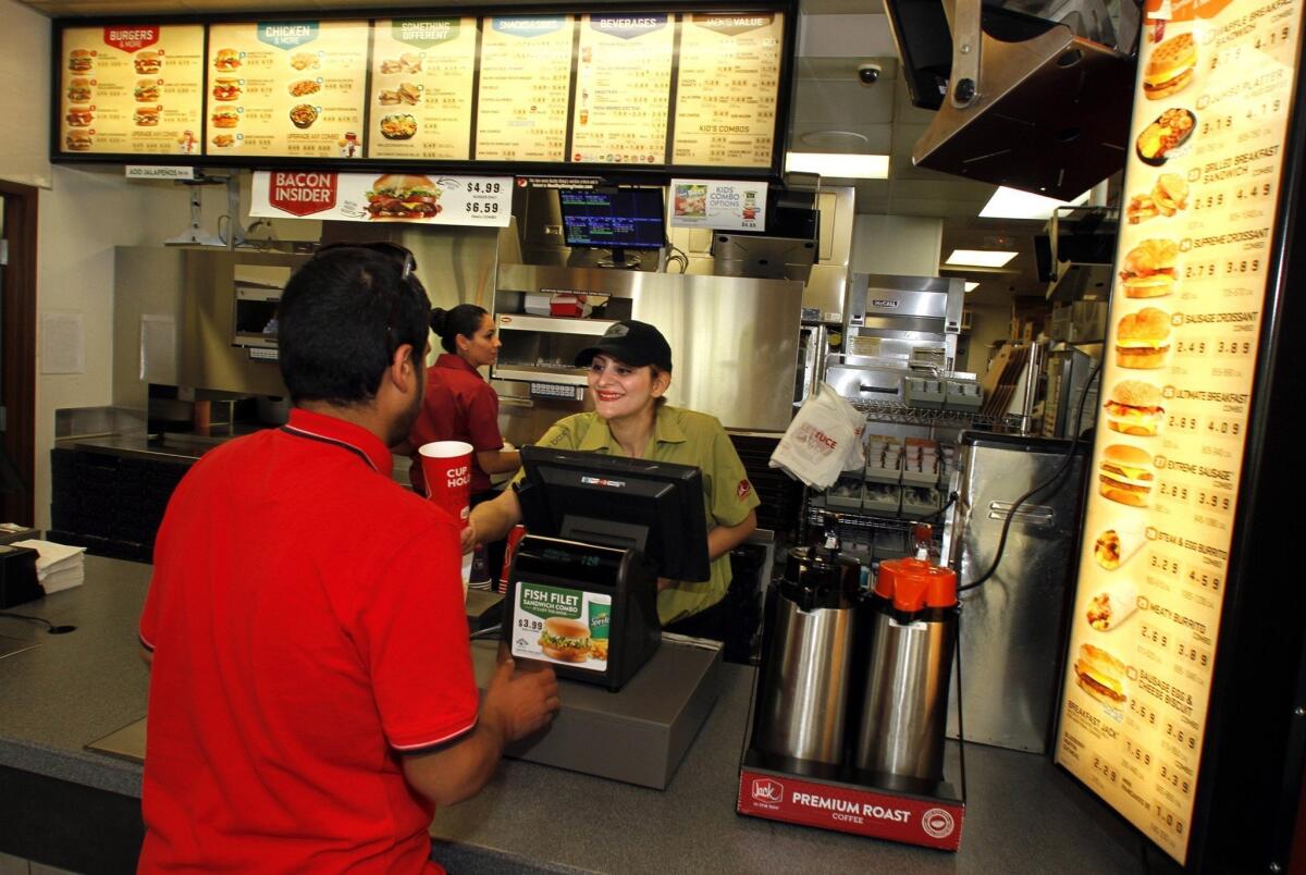 A customer orders food during lunchtime at a Jack in the Box restaurant in Irvine.