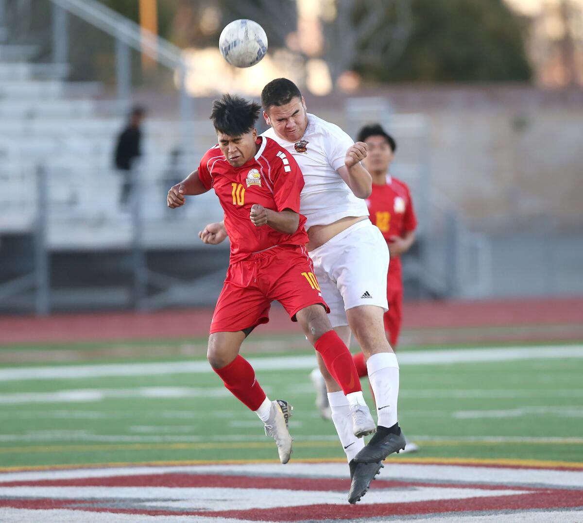 Ocean View’s Anthony Ruiz, left, and Segerstrom’s Frankie Moreno contest a ball at midfield during a Golden West League match on Monday.