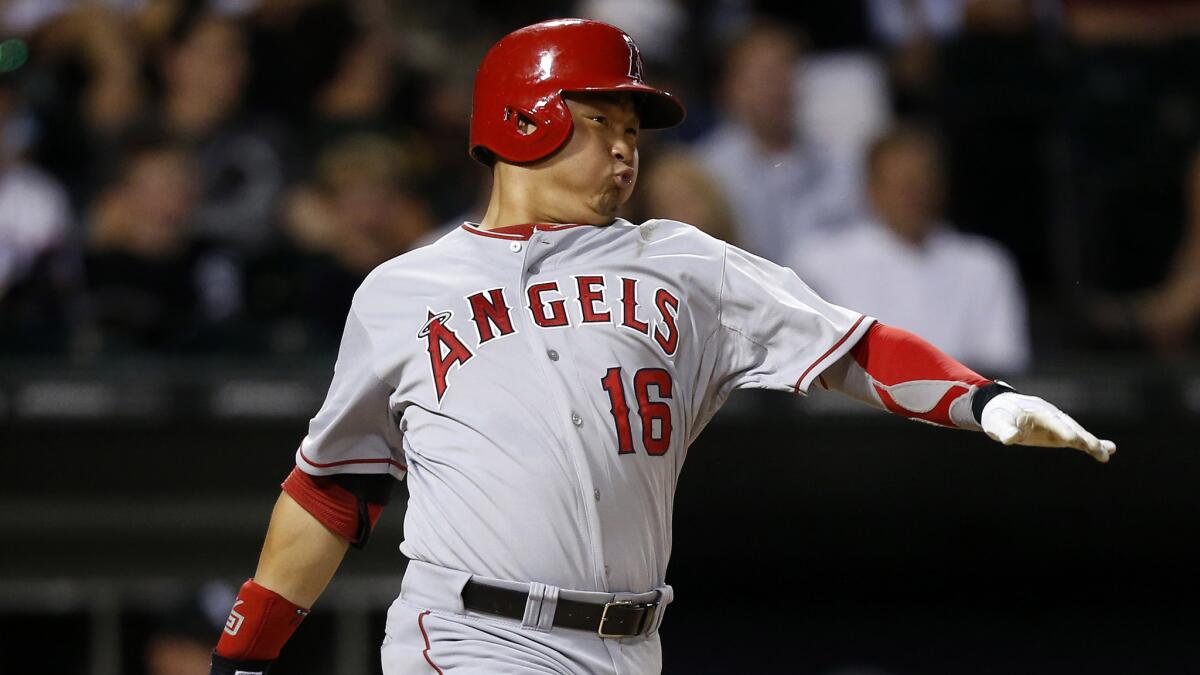 Angels catcher Hank Conger hits a run-scoring single during the sixth inning of the team's 7-5 win over the Chicago White Sox in the second game of a doubleheader.