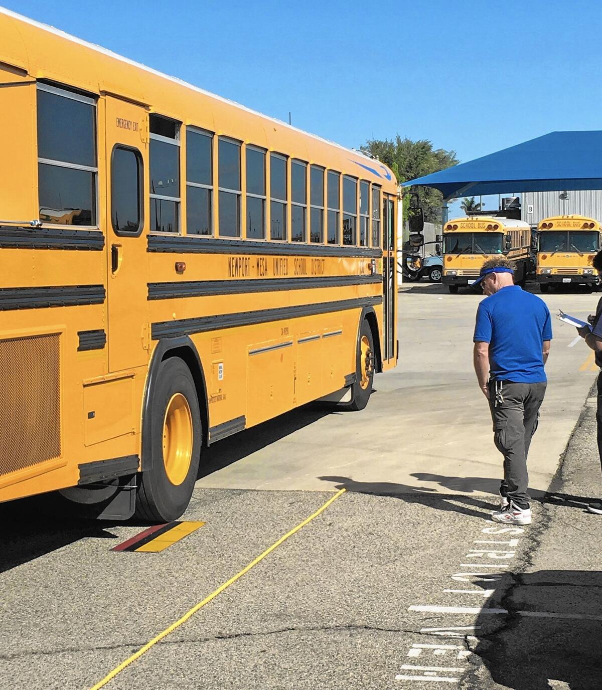 Employees of Newport-Mesa Unified School District's Transportation Department competed in the Orange County School Bus Roadeo in Garden Grove Saturday. Events in the tournament included taking a school bus through different courses and parallel parking.