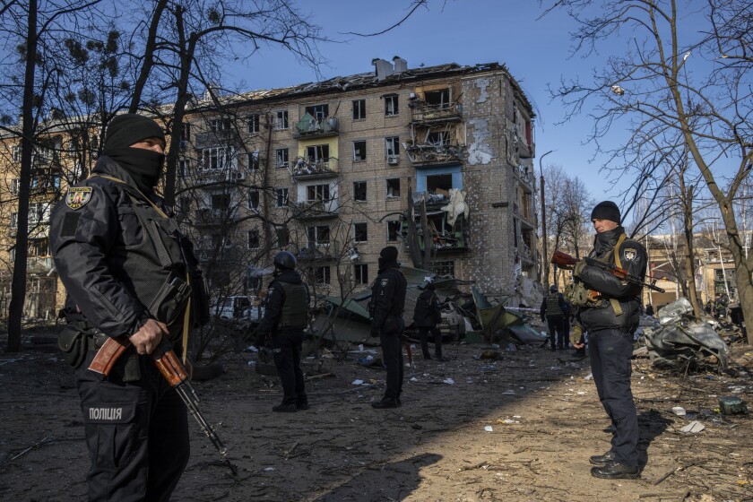 Police standing guard at site of bombed residential buildings