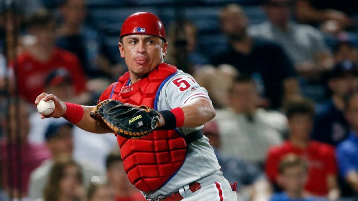 Philadelphia catcher Carlos Ruiz throws out an Atlanta baserunner during a game on July 28.