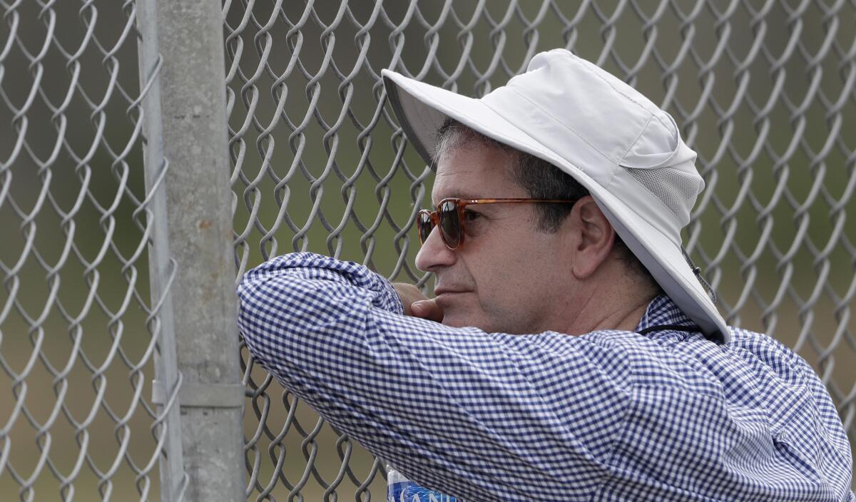 Tampa Bay Rays principal owner Stuart Sternberg watches his pitching staff throw.