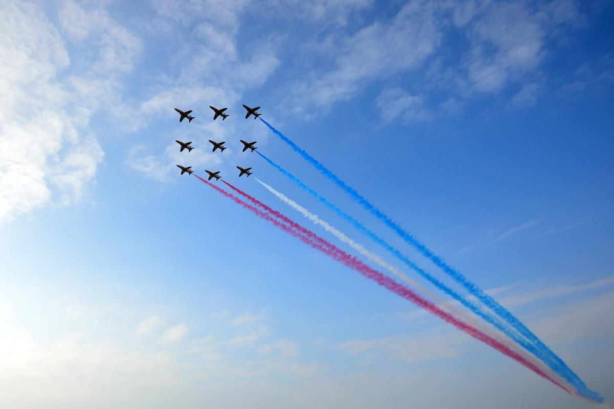 Britain's Red Arrows airplane display team perform over the NATO 2014 Summit at the Celtic Manor Hotel in Newport, South Wales.