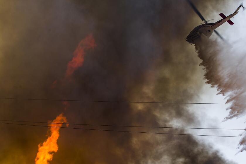 Firefighters with the Camp Pendleton Fire Department combat a 125-acre fire in the Santa Margarita/De Luz Housing area on Marine Corps Base Camp Pendleton July 6.