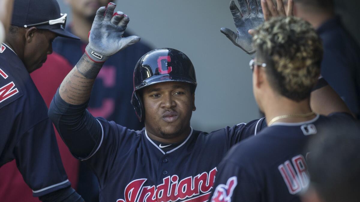 Jose Ramirez is congratulated by teammates after hitting a solo homerun against the Seattle Mariners in September 2017.