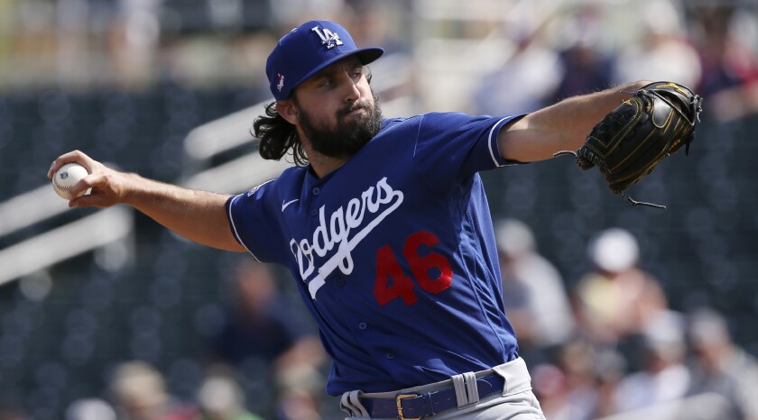 Dodgers starting pitcher Tony Gonsolin throws against the Cleveland Indians during the first inning of a spring training game on Thursday in Goodyear, Ariz.
