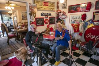 Placentia, CA - March 29: Pat Pattison, right, the host of a weekly TV show "The Best of California", prepares to interview Stanford Freese at his home in Placentia on Wednesday, March 29, 2023. (Scott Smeltzer / Daily Pilot)