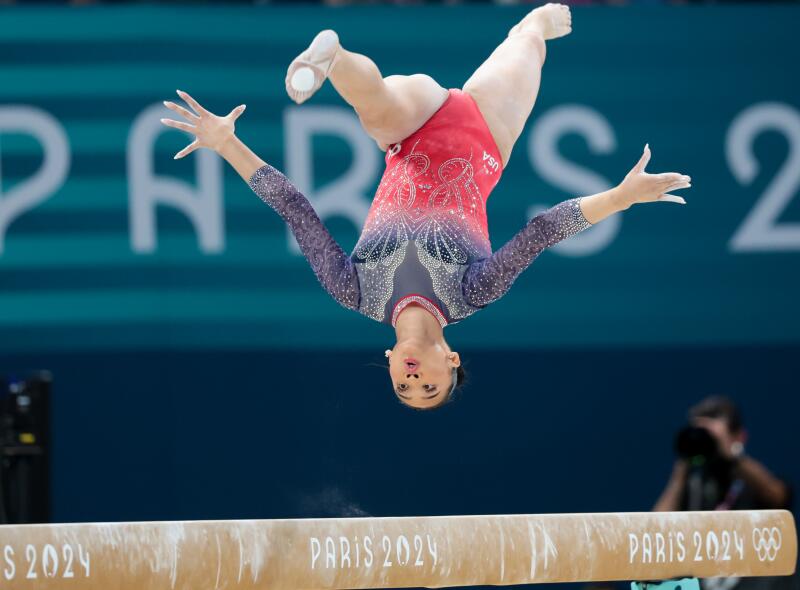 Suni Lee competes on the balance beam at the Paris Olympics.