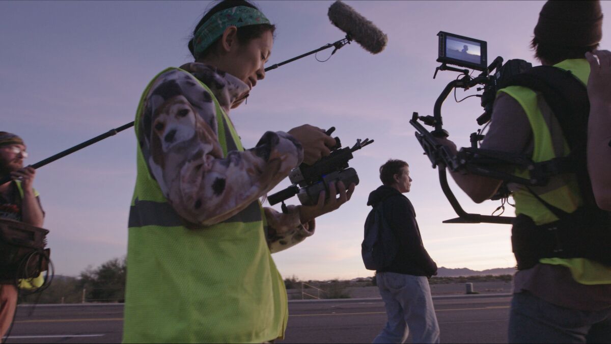 Director/Writer Chloe Zhao and Frances McDormand on the set of 'Nomadland'