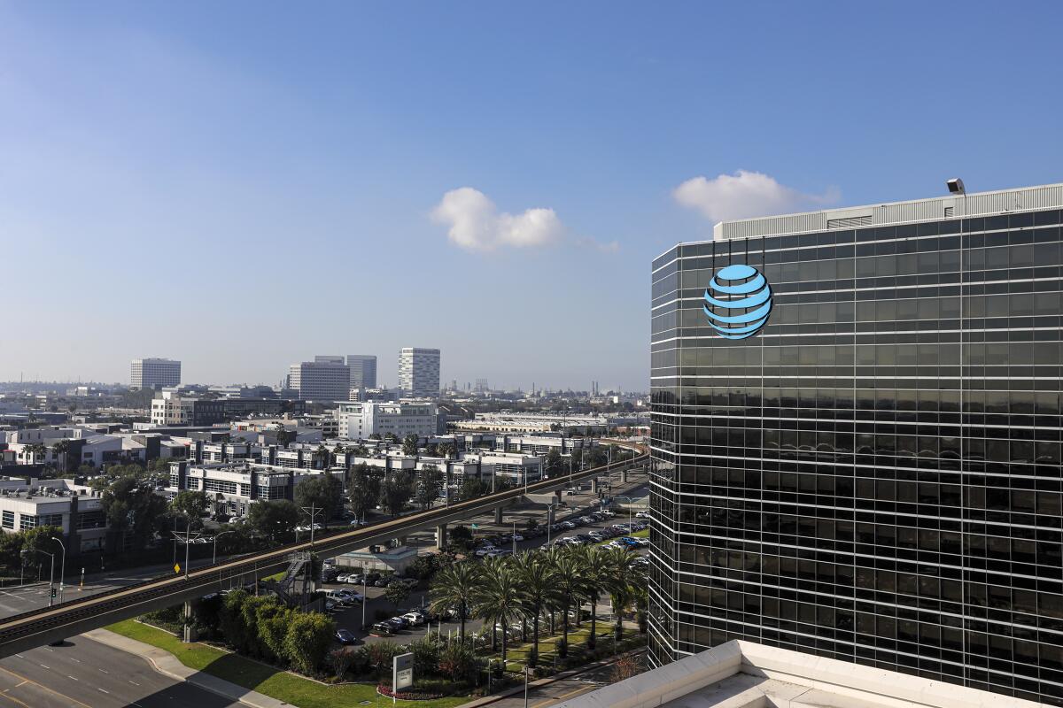 A view of the exterior of a multistory glass building with the AT&T logo.