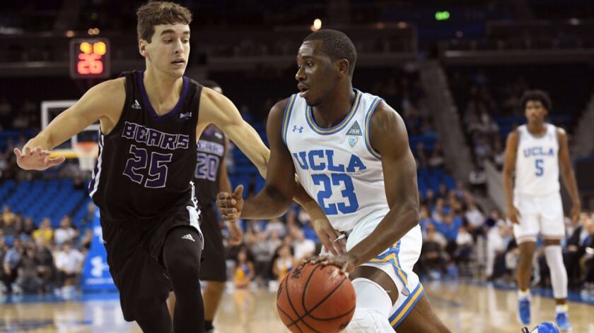 UCLA's Prince Ali (23) drives against Central Arkansas' Thatch Unruh (25) during the first half on Wednesday.