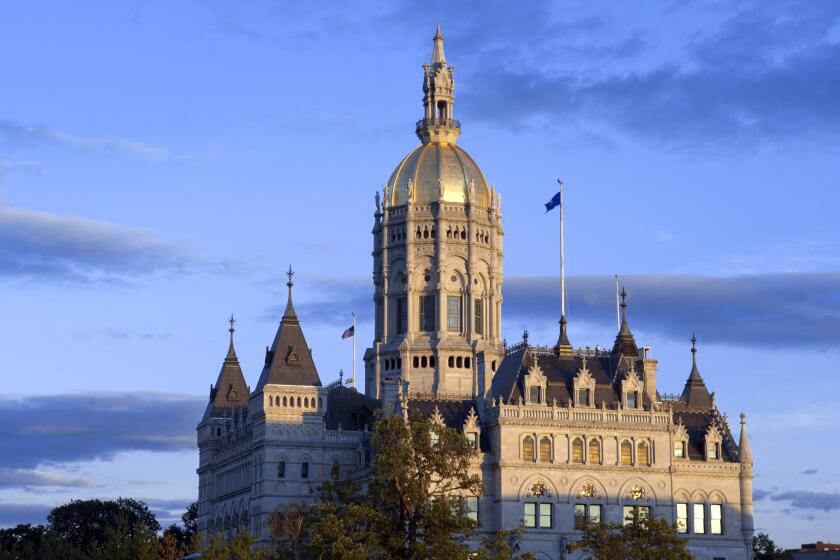 FILE - The Connecticut State Capitol building is seen in Hartford, Conn., on Oct. 1, 2012. A group of Hispanic lawmakers in Connecticut proposed Wednesday, Feb. 1, 2023, that the state follow Arkansas' lead and ban the term “Latinx” from official government documents, calling it offensive to Spanish speakers. (AP Photo/Jessica Hill, File)