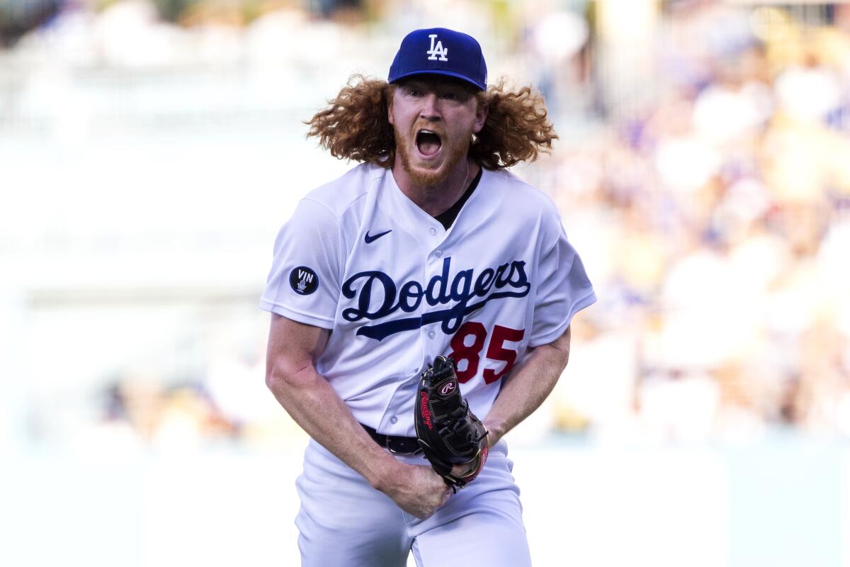 Los Angeles Dodgers starting pitcher Dustin May reacts on the mound after striking out Miami Marlins' Nick Fortes, with the bases loaded, during the first inning of a baseball game in Los Angeles, Saturday, Aug. 20, 2022. (AP Photo/Alex Gallardo)