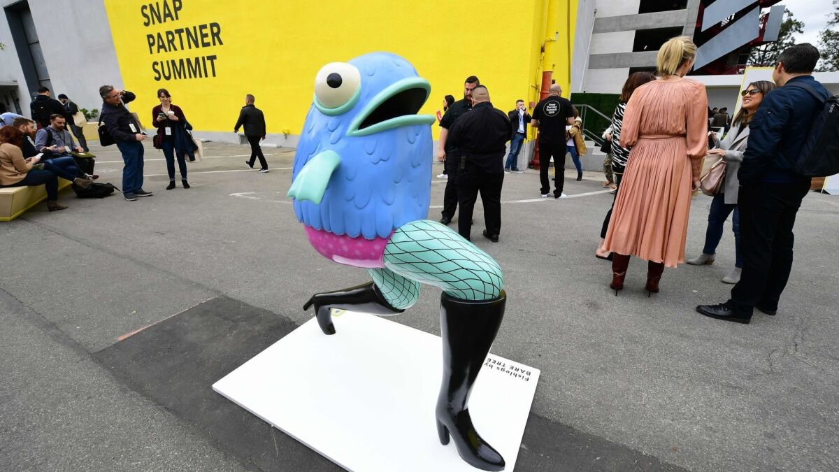 A sculpture of one of Snap's augmented reality lenses, "Fishlegs," greets people at the Snap Partner Summit in West Hollywood on April 4.