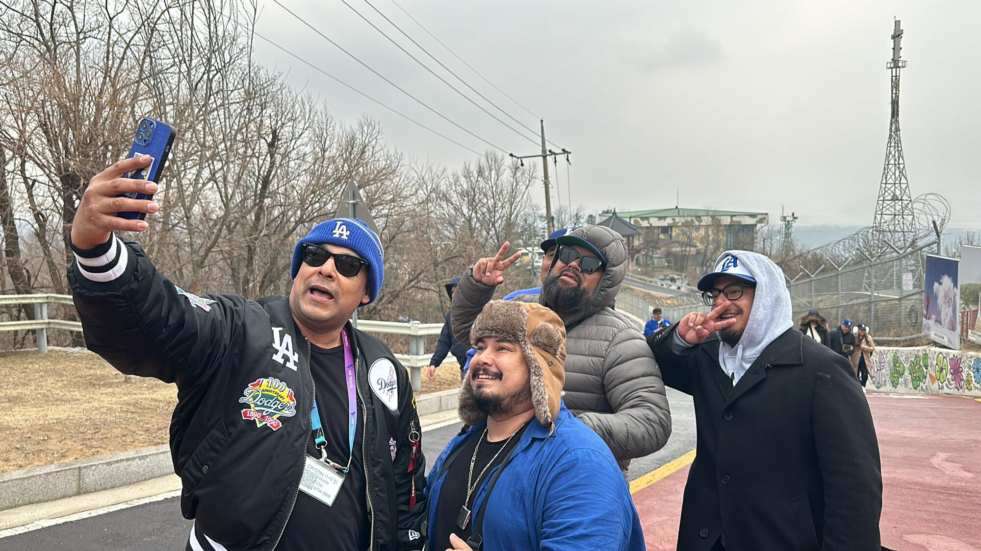 Members of Pantone 294, a Dodgers fan group, pose for a selfie while touring the demilitarized zone in Korea. 