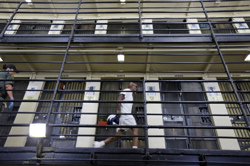 A man walks along a corridor in San Quentin prison's death row.