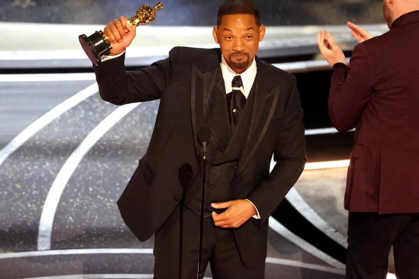HOLLYWOOD, CA - March 27, 2022. Will Smith accepts the award for Best Actor in a Leading Role for "King Richard" during the show at the 94th Academy Awards at the Dolby Theatre at Ovation Hollywood on Sunday, March 27, 2022. (Myung Chun / Los Angeles Times)