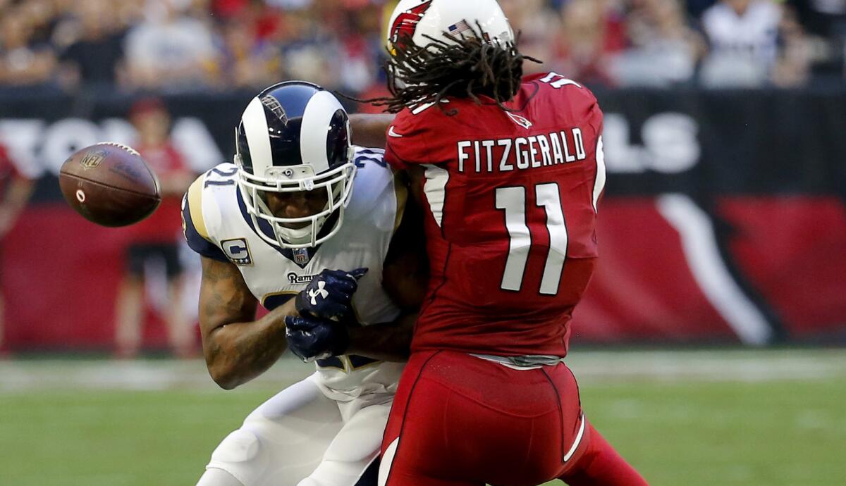 Rams cornerback Aqib Talib breaks up a pass intended for Cardinals wide receiver Larry Fitzgerald during a game Dec. 23.