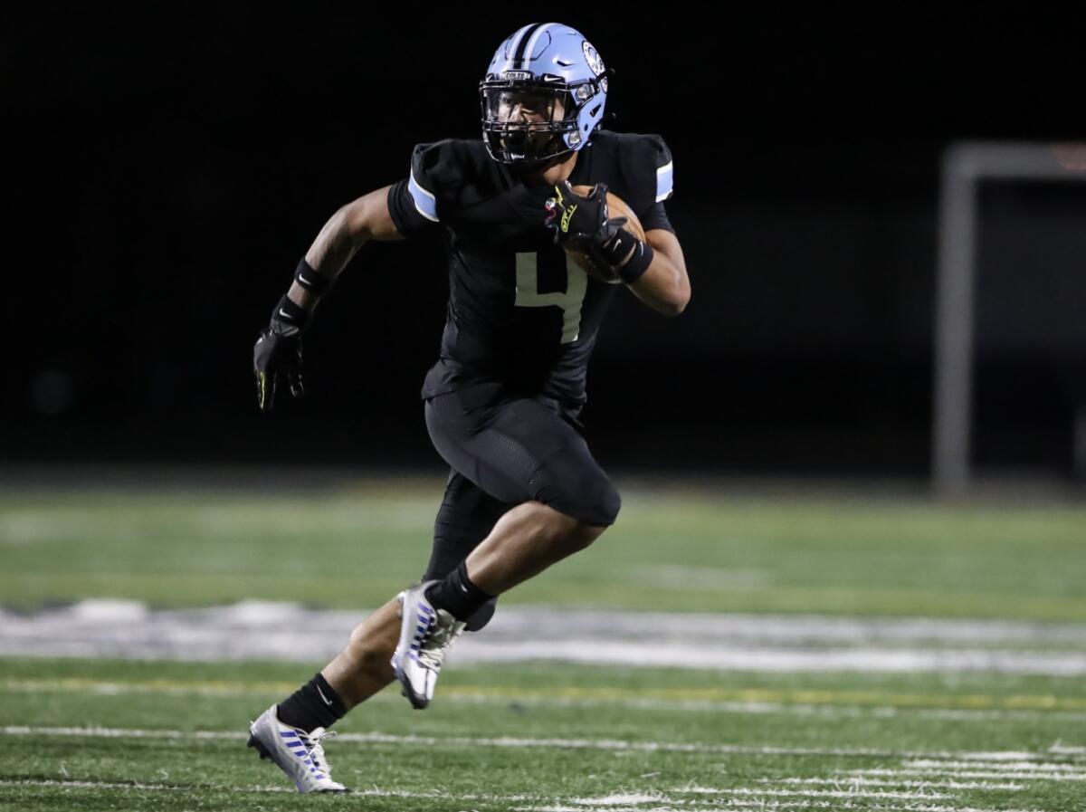 Junior running back-linebacker Jerry Misaalefua of Carson breaks into the clear on a rushing attempt.