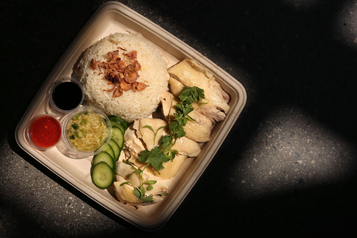 The signature dish at Side Chick is the Hainan chicken rice. The restaurant is located inside the Westfield Santa Anita mall in Arcadia.