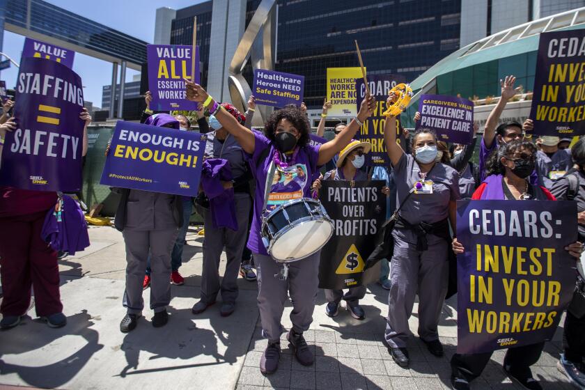 LOS ANGELES, CA - MAY 09: Members of the Service Employees International Union-United Healthcare Workers West started weeklong strike today at Cedars-Sinai Medical Center on Monday, May 9, 2022 in Los Angeles, CA. Workers are alleging safety concerns, short-staffing and low wages at the hospital. Among the workers taking part are nursing assistants, lab technicians, surgical technicians and plant operations workers. (Francine Orr / Los Angeles Times)