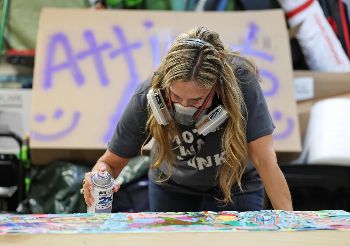 Artist C.C. Knowles prepares to finish a piece for her Attic to Art business in her Newport Beach garage.