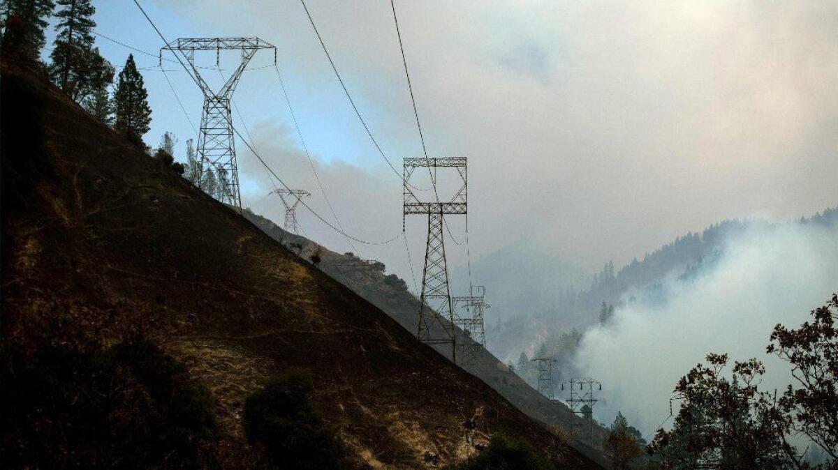Power lines are seen against a smoky landscape east of Paradise, Calif., on Nov. 11.