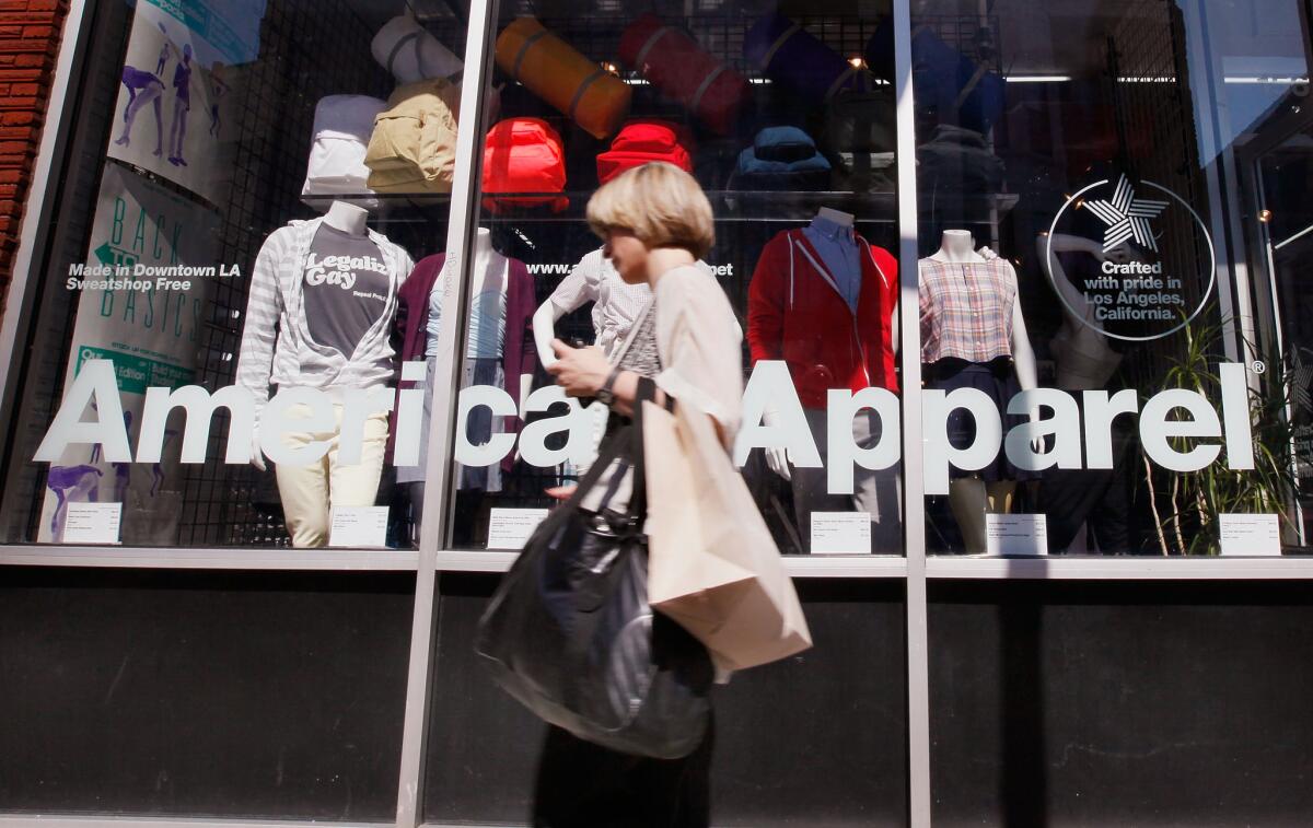 A pedestrian passes an American Apparel store in Chicago on Sept. 4, 2009.