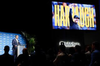 The video board boasted new Chargers coach Jim Harbaugh.