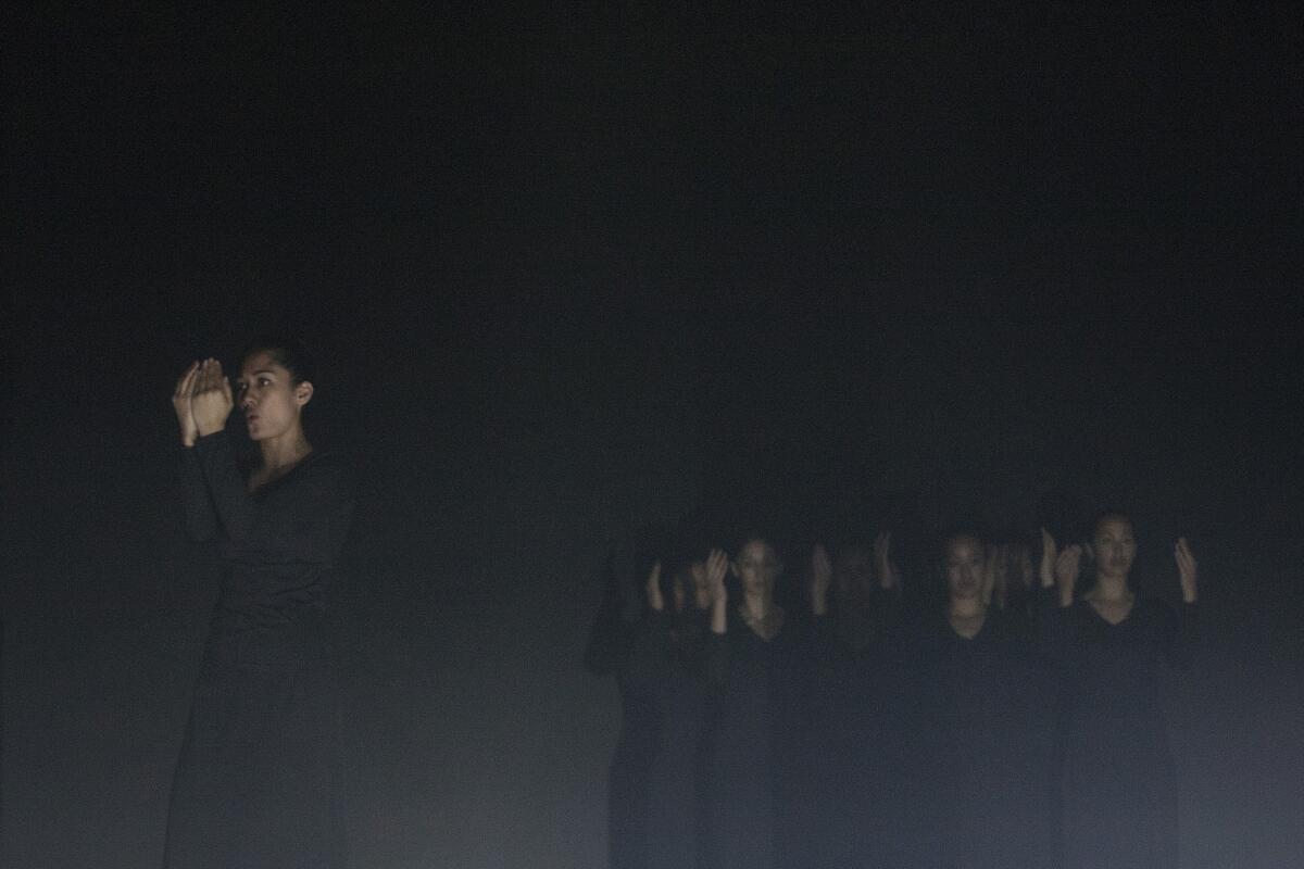 Cast members from "Stone in Her Mouth" attend a dress rehearsal at the Palace Theatre in Los Angeles on September 26, 2013. The piece is a ritualistic dance and theater piece choreographed by Lemi Ponifasio and his company, MAU.